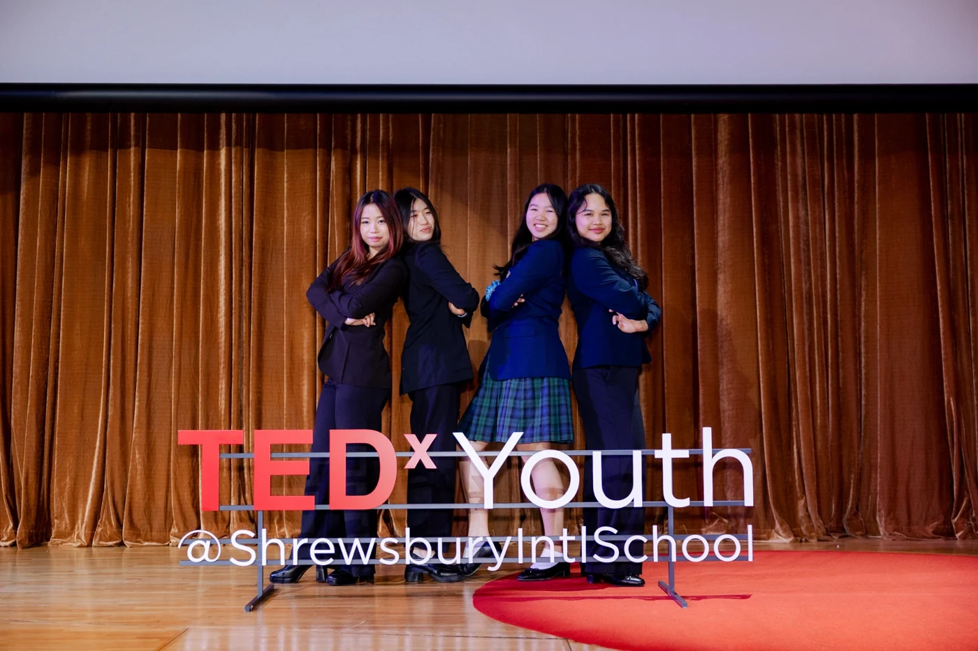 Two speakers on a TEDx Youth stage