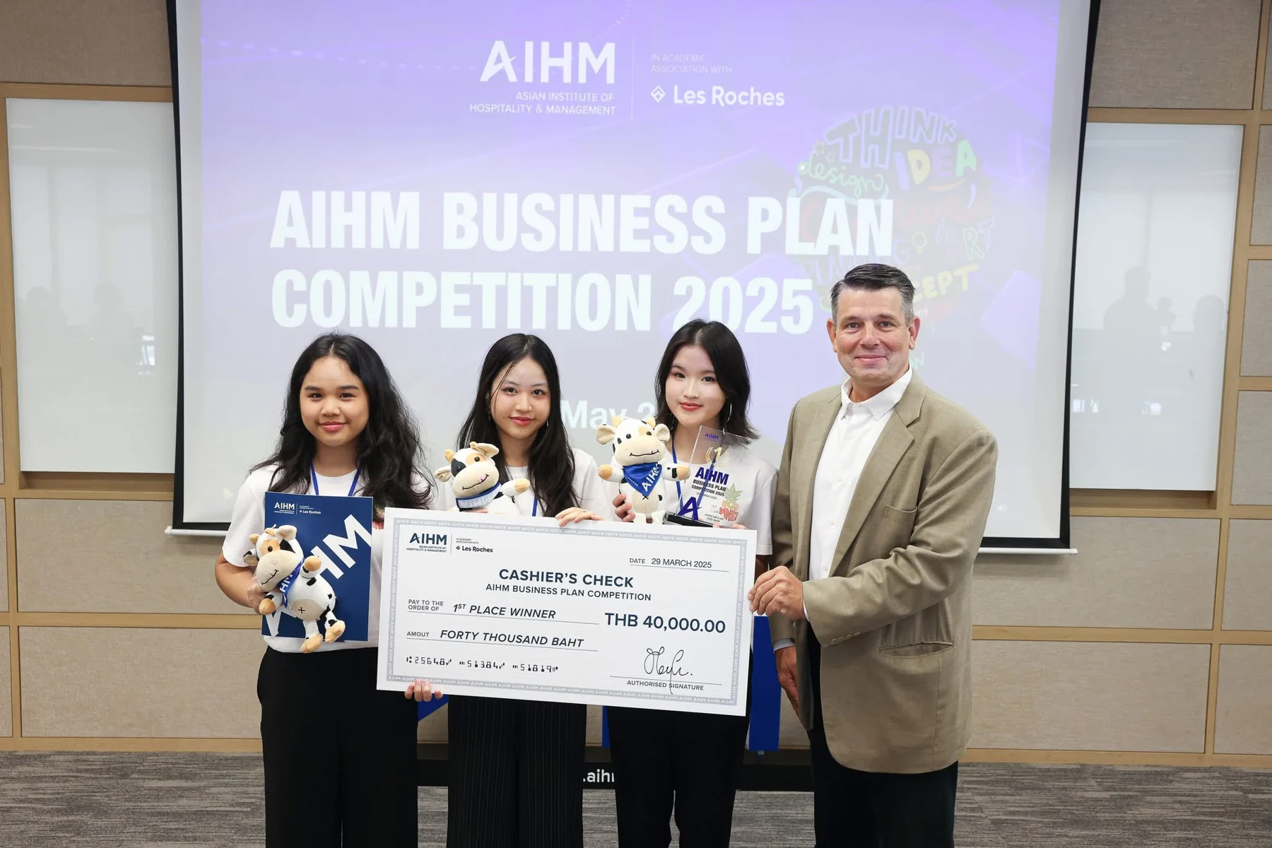 EcoPinet team holding a competition cheque