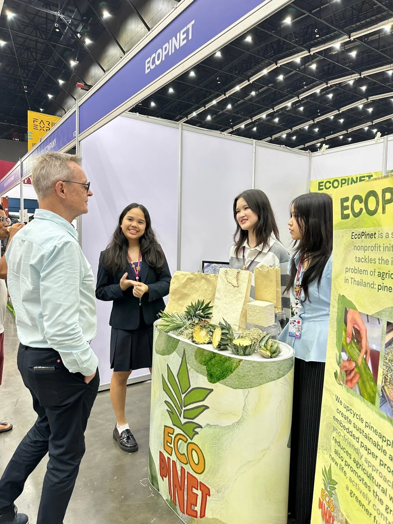 Visitors at an EcoPinet booth