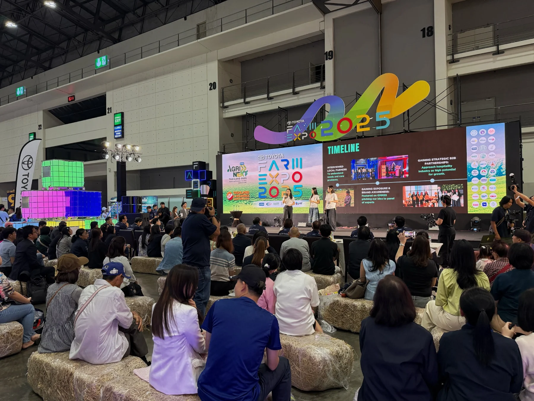An audience at an exhibition presentation